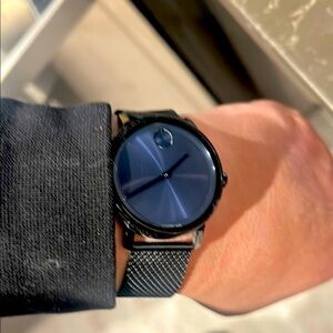 Elegant Blue and Black Watch with Minimalist Design